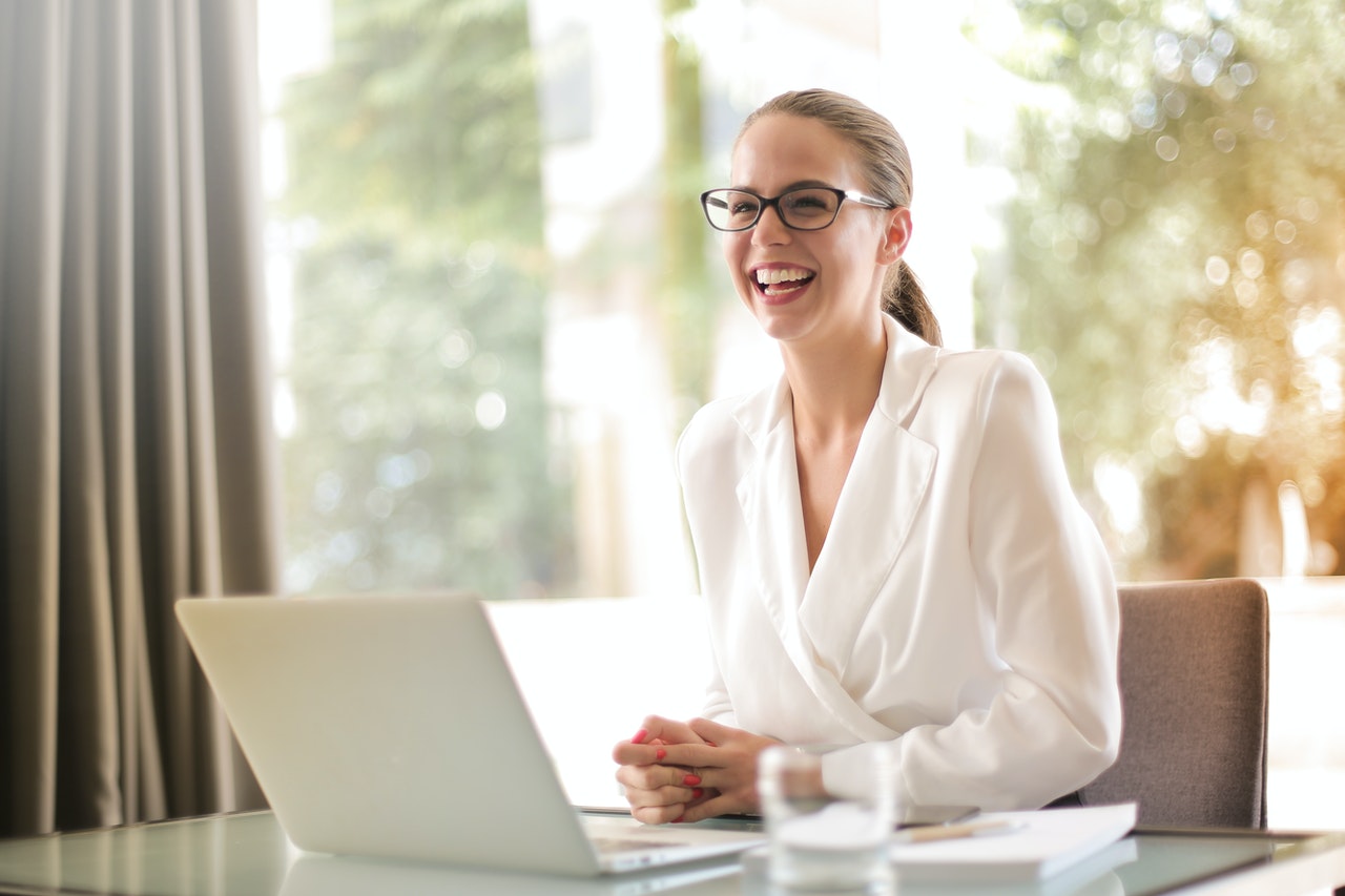 Happy person using laptop