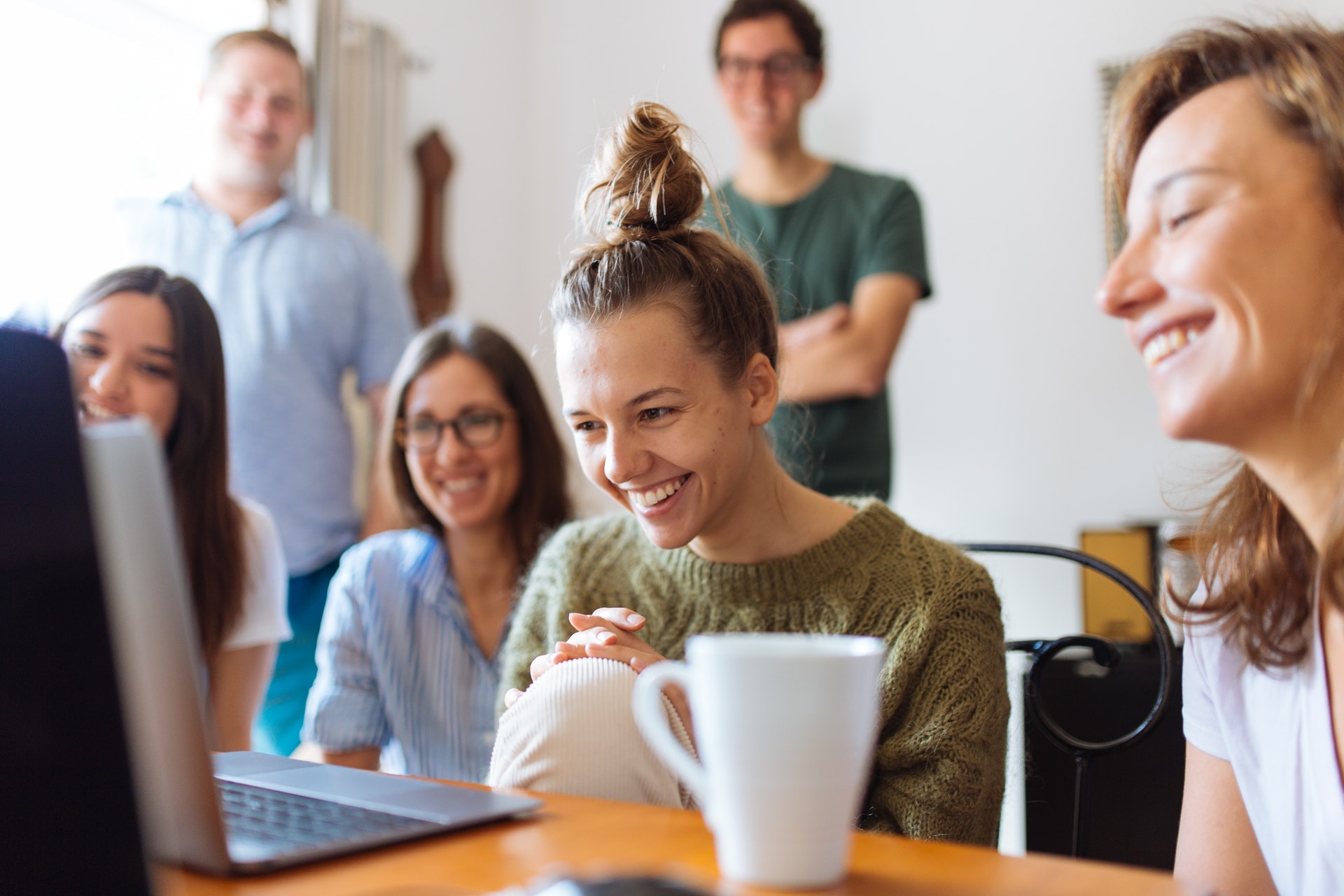 People smiling at laptop